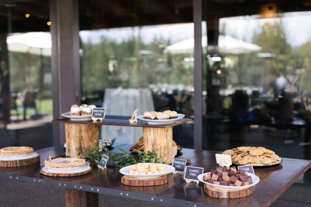 Wedding dessert bar of fudge, cupcakes and pies.