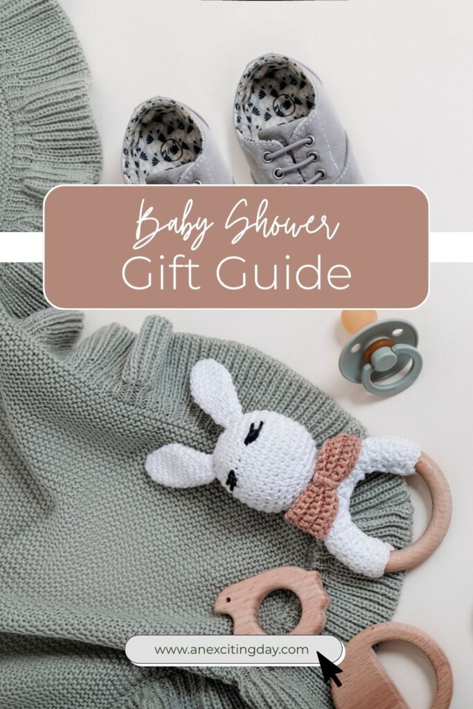 Blue baby blanket with baby shoes next to it and wooden baby toys - overlay text reading "registry must-haves baby shower gift guide links included".